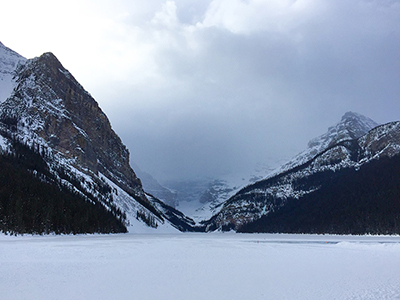 A Valley located between two snowy mountains.