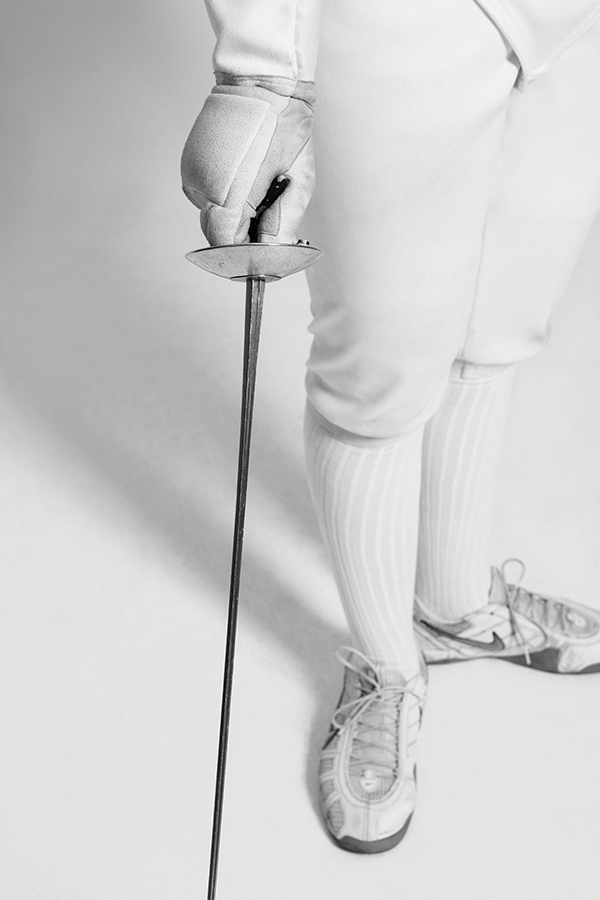 A close-up view of a fencer and their rapier