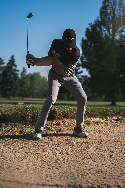 Golfer Peter Drew readies his golf swing.