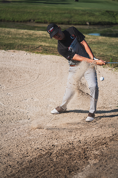 Golfer peter drew scores a mighty hit on the golf ball!