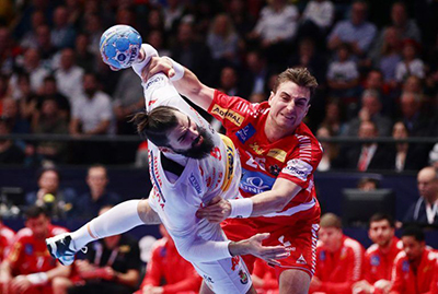 An aggressive tackle in a game of handball