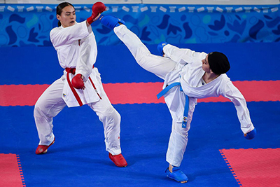 A Pair of karatekas face off in the ring