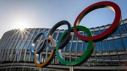 The olympic logo in front of a building