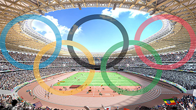 An inside view of the stadium with the olympic logo in the center