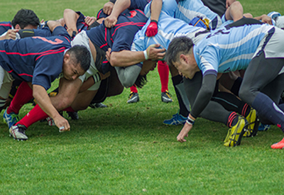 A group of rugby players in a struggle pile