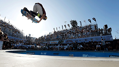 A Skateboarder pulling off some mid-air tricks