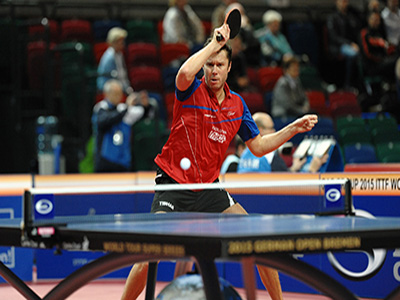 A Player preapres his ping-pong serve.