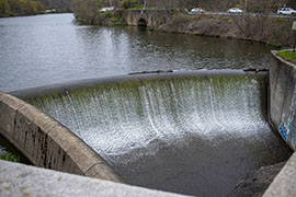 A Dam with some graffiti visible in the lower-right corner