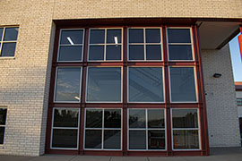 A window that hides a pair of stairs leading up within.